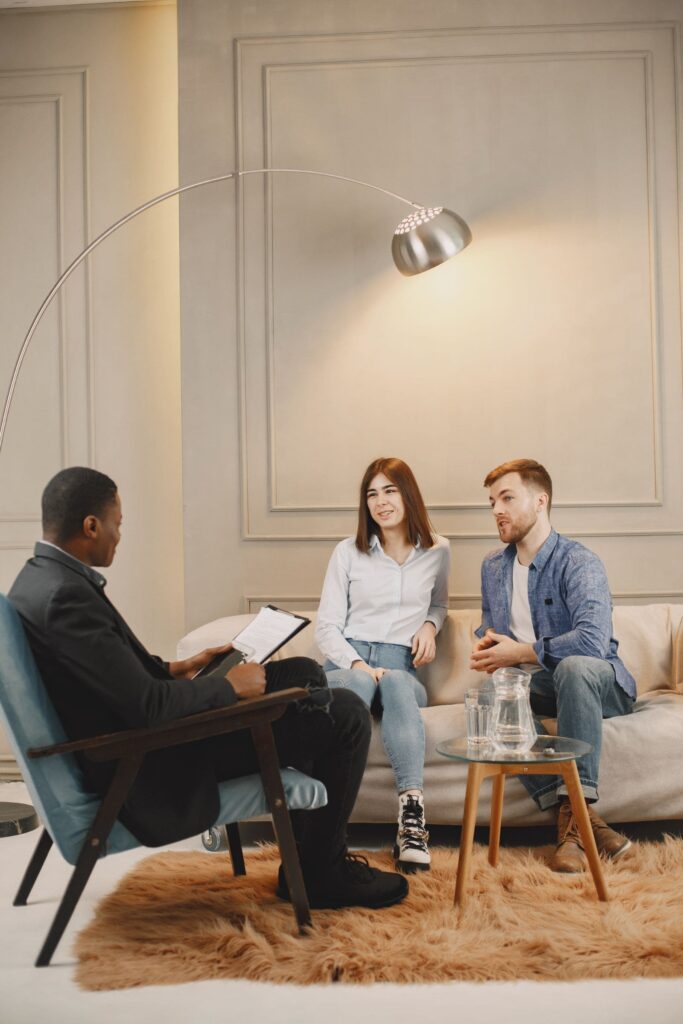 A group of people discussing mental health treatment