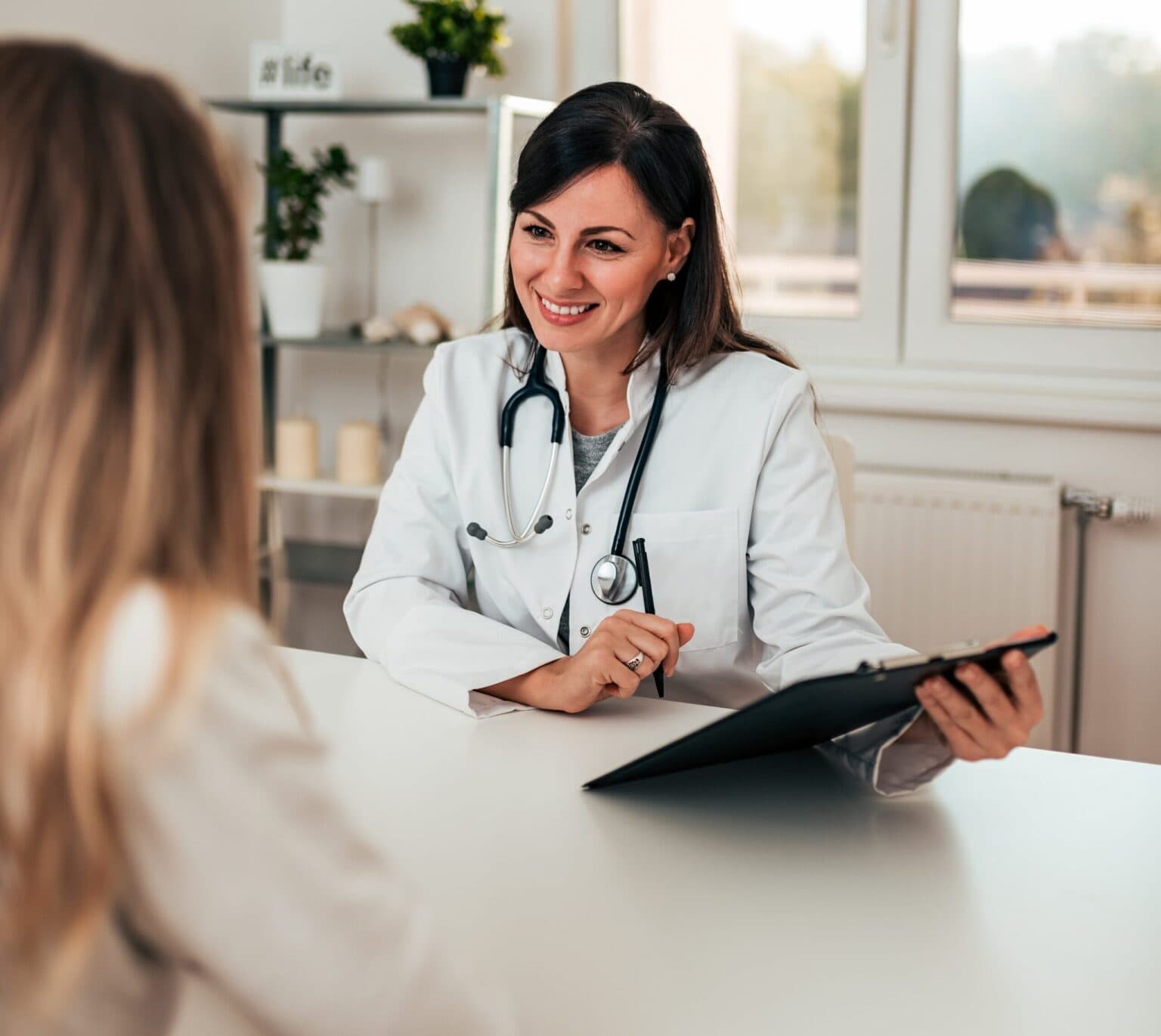A psychiatrist speaking to a client about getting mental health treatment