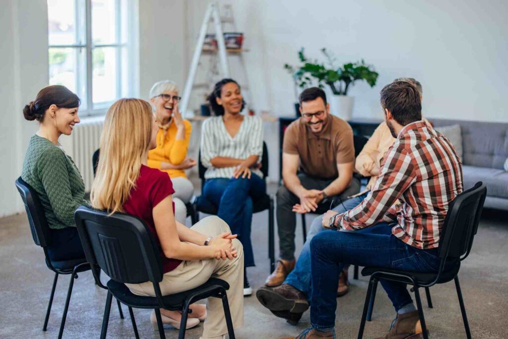 People participating in a group therapy session as part of a mental health treatment program in New Jersey