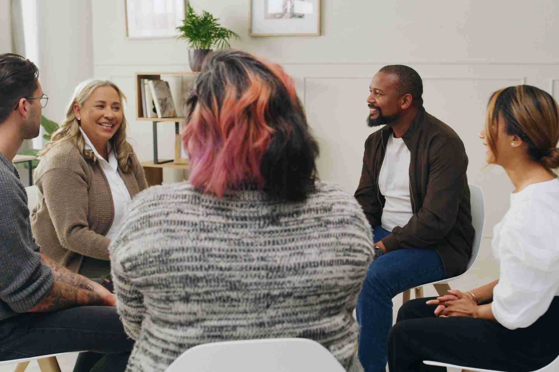 People participating in a group therapy and mental health support meeting