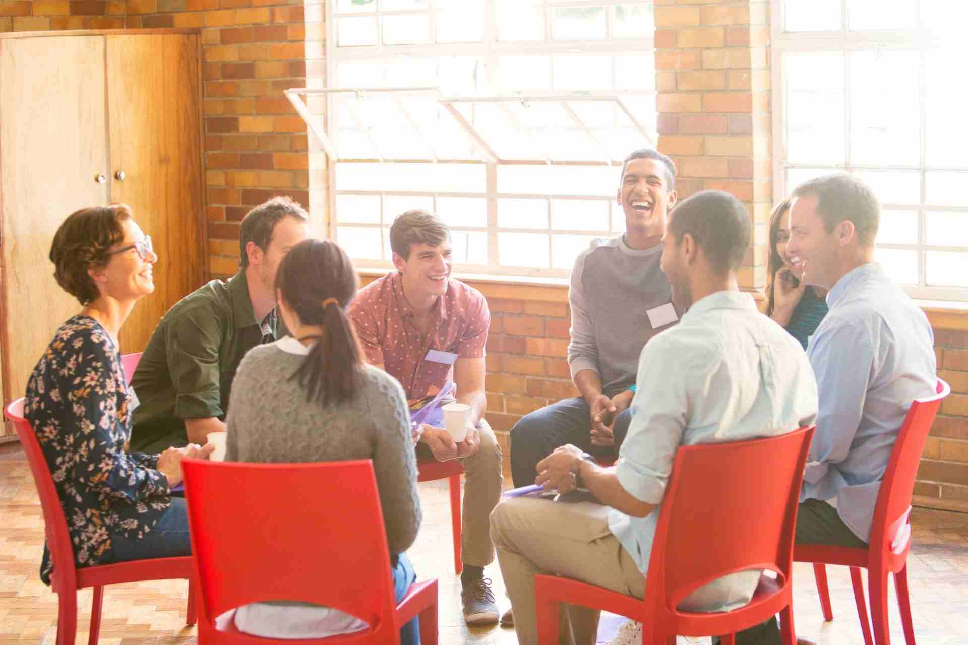 Young adults participating in a group therapy session during outpatient mental health treatment